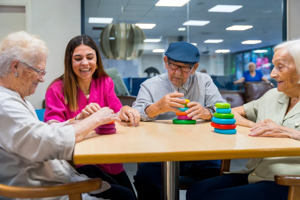 A group of seniors use blocks to retain fine motor skills during occupational therapy.